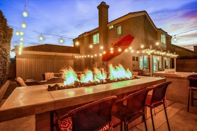 a view of a chairs and table in a patio