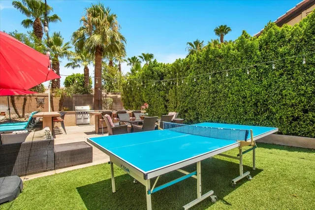 a front view of a house with a garden and a yard