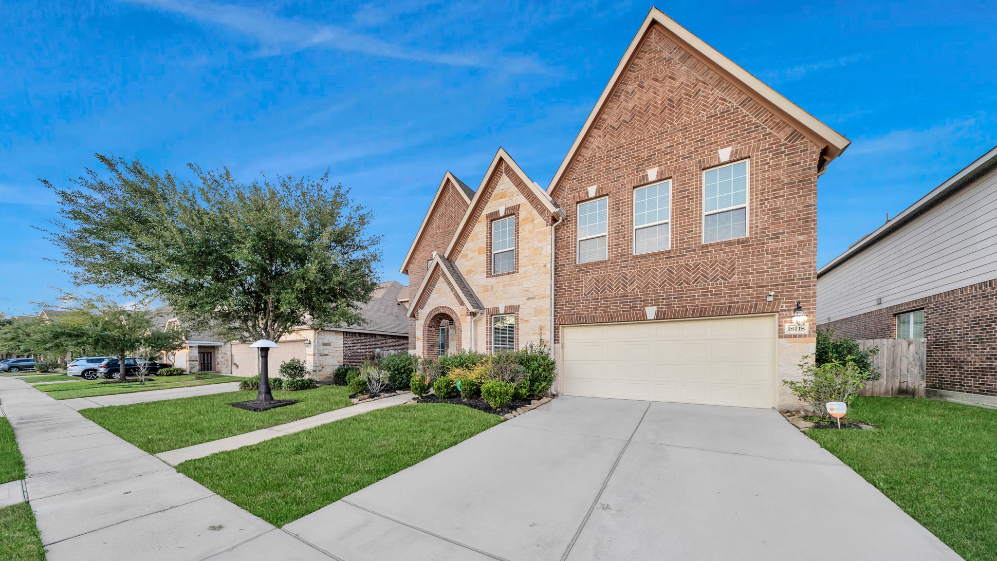 18118 Berry Garden Lane Spring, TX 77379 - Photo 3 of 45 Stunning front façade with well-maintained landscaping and great curb appeal.