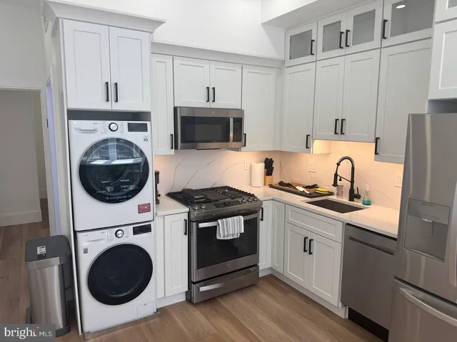 a kitchen with a stove and a sink