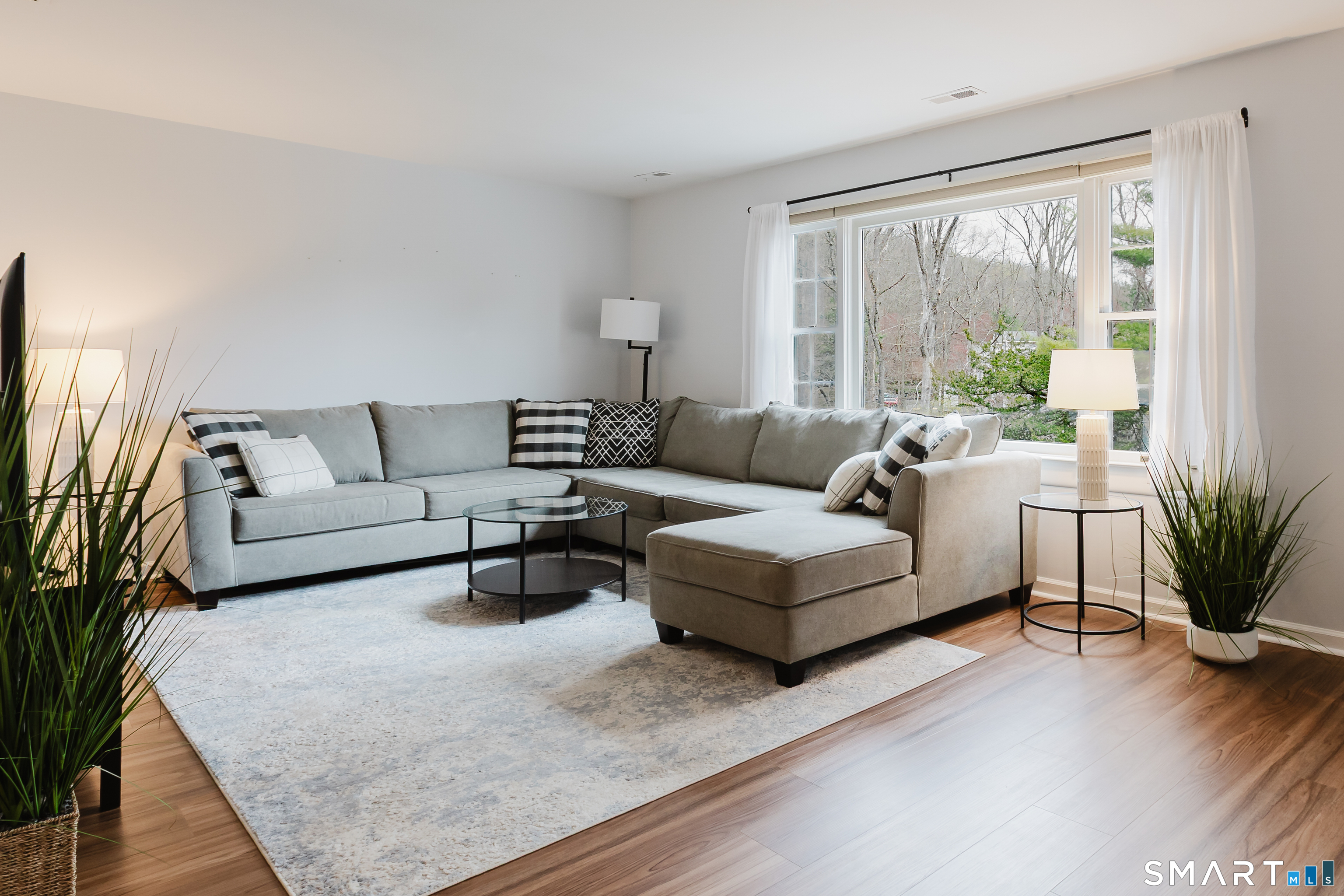 40 Village Walk, Unit 40 Wilton, CT 06897 - Photo 1 of 40 Bask in the Living Room sunlight & spaciousness