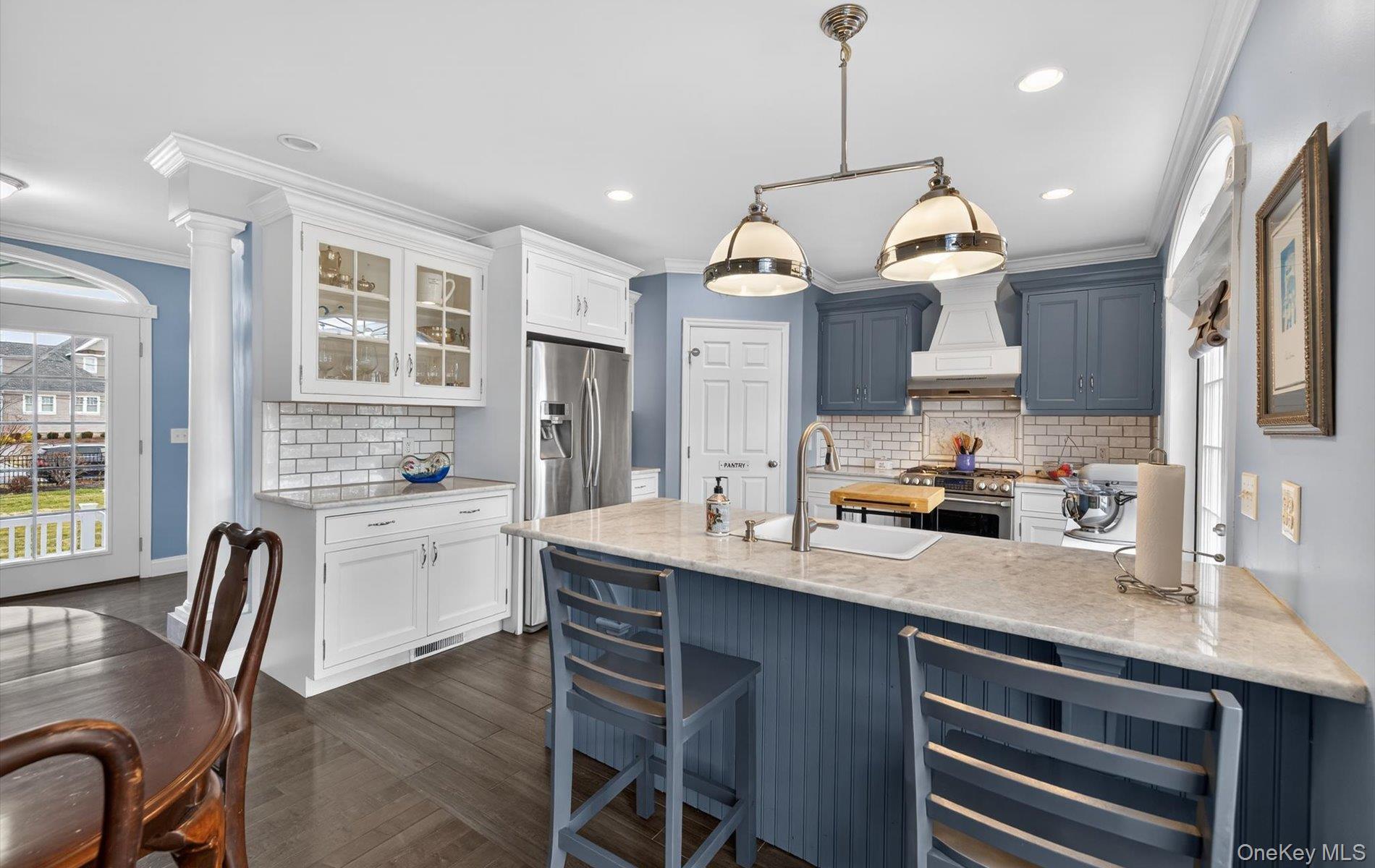 108 Awixa Avenue Bay Shore, NY 11706 - Photo 7 of 47 Kitchen with wine cooler, light stone counters, tasteful backsplash, glass insert cabinets, and stainless steel stove