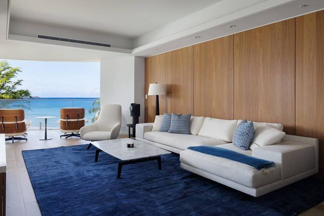 a living room with furniture a fireplace and a table