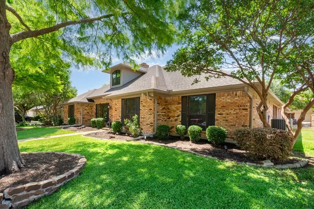 a view of a house with a yard porch and sitting area