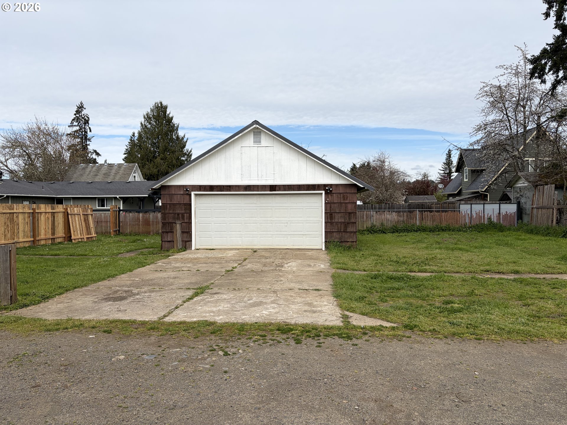 1st Street Cottage Grove, OR 97424 - Photo 3 of 3 a front view of a house with garden
