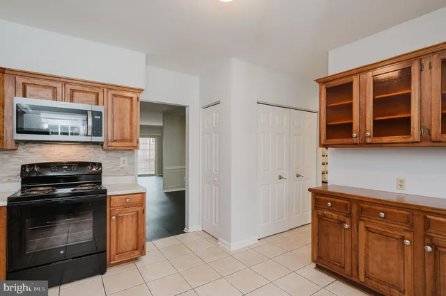 a kitchen with stainless steel appliances a stove and a refrigerator