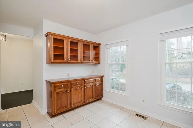 a view of a kitchen with stainless steel appliances granite countertop cabinets and window