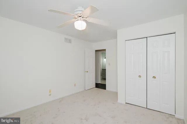 an empty room with fan