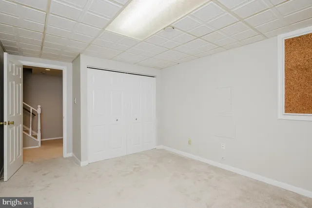 a view of an empty room and a window