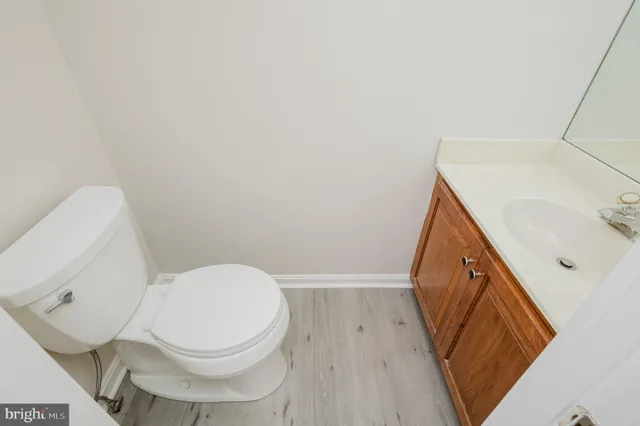 a white toilet sitting next to a sink