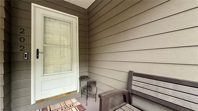 a view of a door and wooden floor
