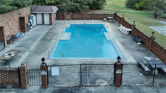 a view of a backyard with sitting area