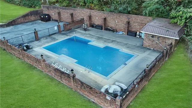 a view of a backyard with a tub and trees