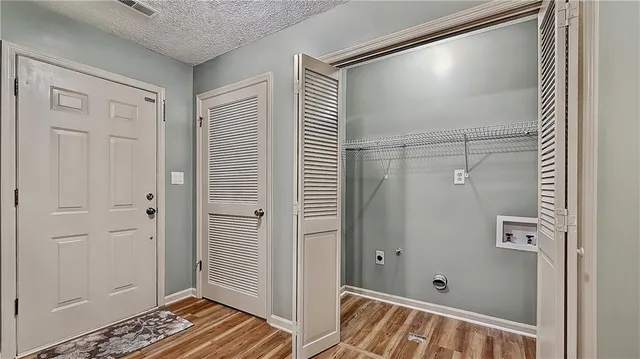 a bathroom with a shower and a sink