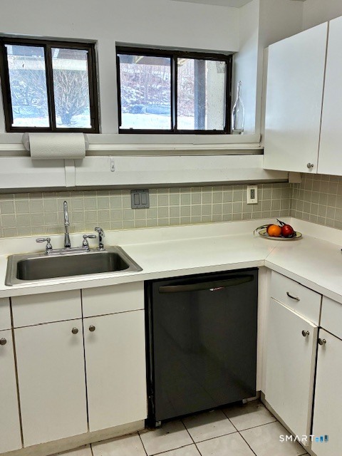 175 Mill Pond Road, Unit 201 Hamden, CT 06514 - Photo 4 of 8 a kitchen with white cabinets and a sink