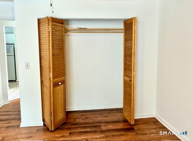 175 Mill Pond Road, Unit 201 Hamden, CT 06514 - Photo 6 of 8 a view of a room with wooden floor