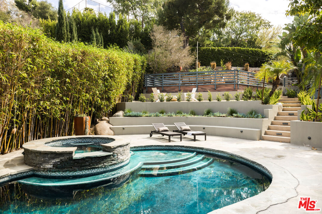 2510 Park Oak Drive Los Angeles, CA 90068 - Photo 2 of 38 a swimming pool with outdoor seating and green space