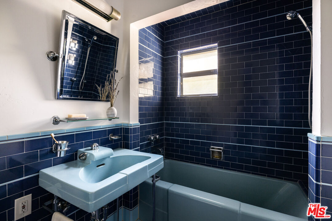 2510 Park Oak Drive Los Angeles, CA 90068 - Photo 23 of 38 a bathroom with a sink a toilet and mirror