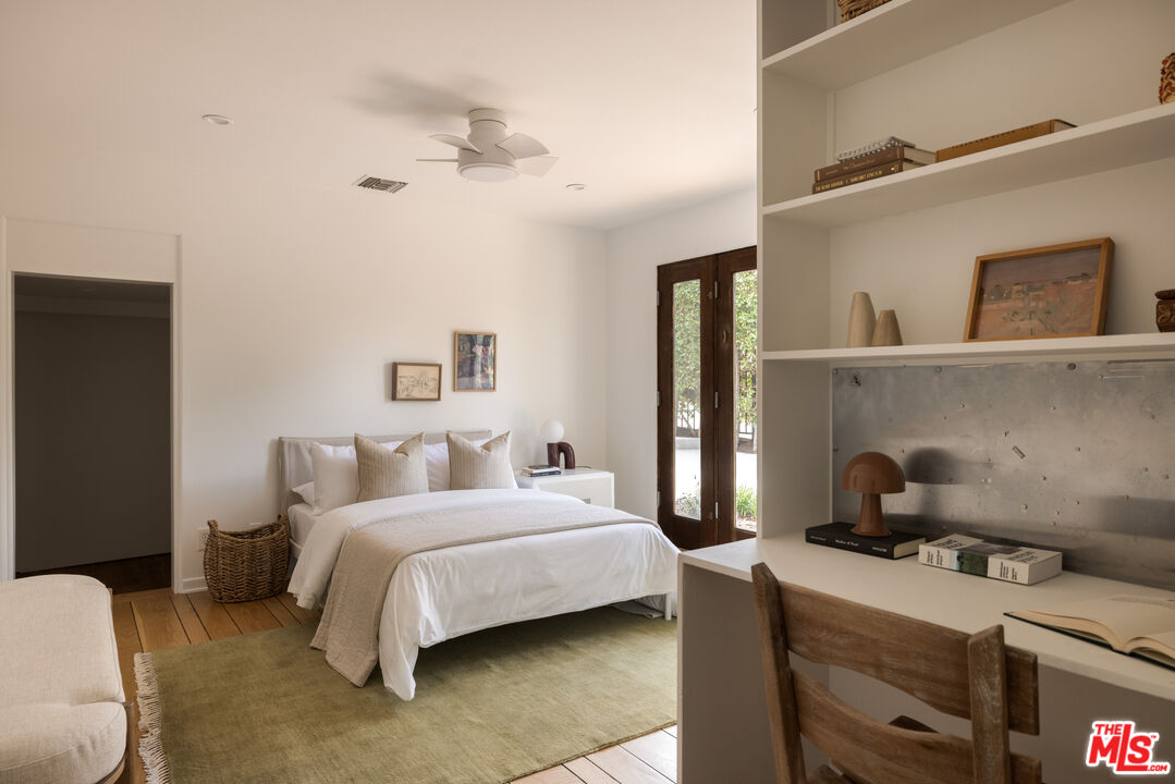 2510 Park Oak Drive Los Angeles, CA 90068 - Photo 24 of 38 a bedroom with a bed and a lamp on the dresser
