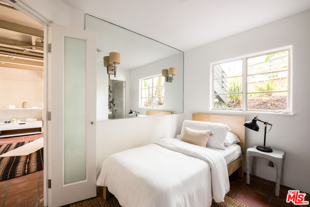 2510 Park Oak Drive Los Angeles, CA 90068 - Photo 27 of 38 a bedroom with a bed and a window