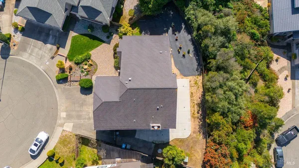 an aerial view of residential houses with outdoor space