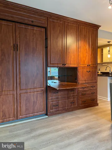 a view of a swimming pool and lounge chairs