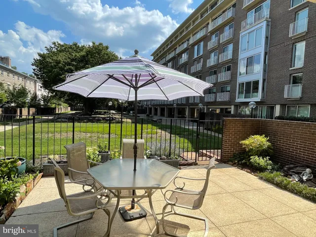 a view of a swimming pool and lounge chairs