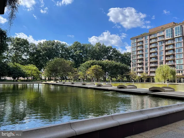 a view of a room with gym equipment and a large window
