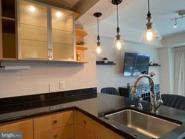 a kitchen with a sink and cabinets