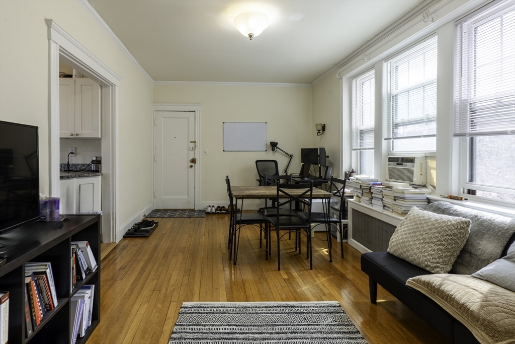 31 Winslow Road, Unit 3 Brookline, MA 02446 - Photo 4 of 10 a living room with furniture and a flat screen tv