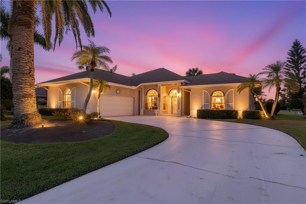 a front view of a house with a yard