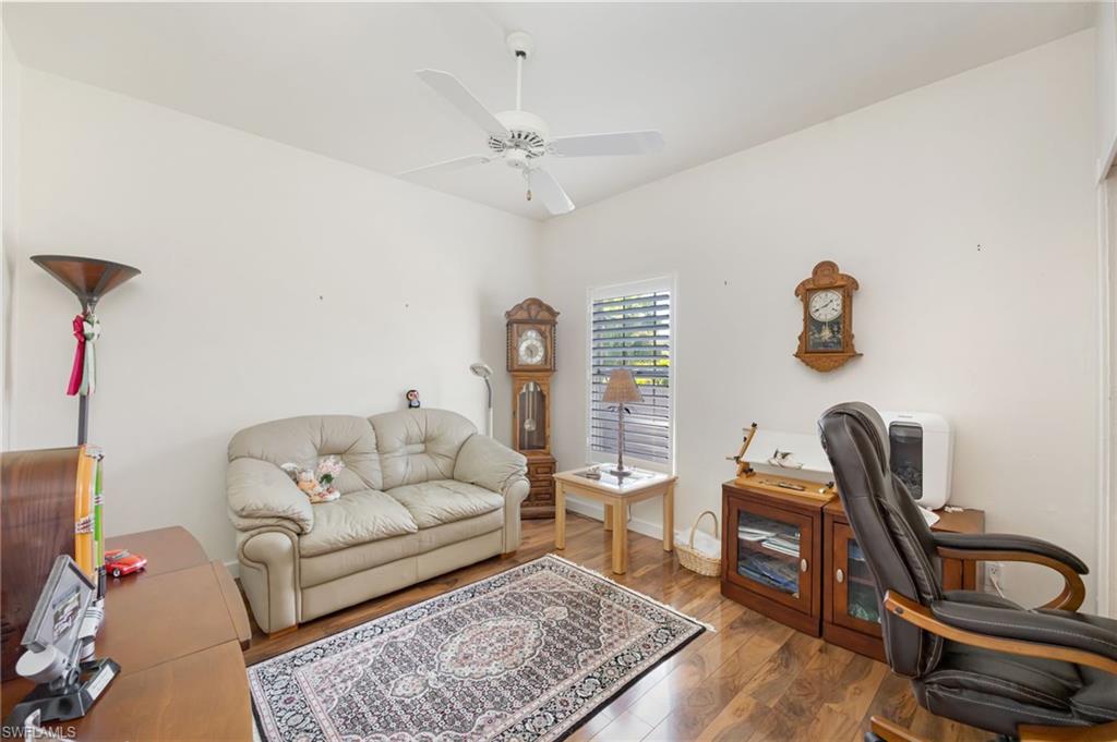 867 St Andrews Boulevard Naples, FL 34113 - Photo 19 of 28 a living room with furniture a rug and a window