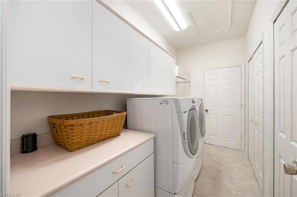 867 St Andrews Boulevard Naples, FL 34113 - Photo 22 of 28 a utility room with dryer and washer