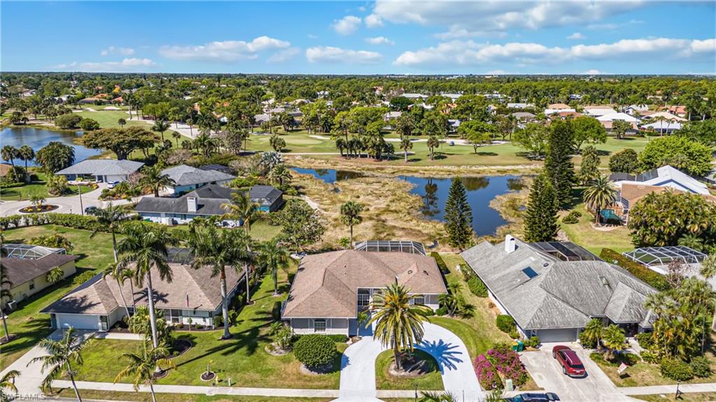 867 St Andrews Boulevard Naples, FL 34113 - Photo 4 of 28 an aerial view of residential houses with outdoor space