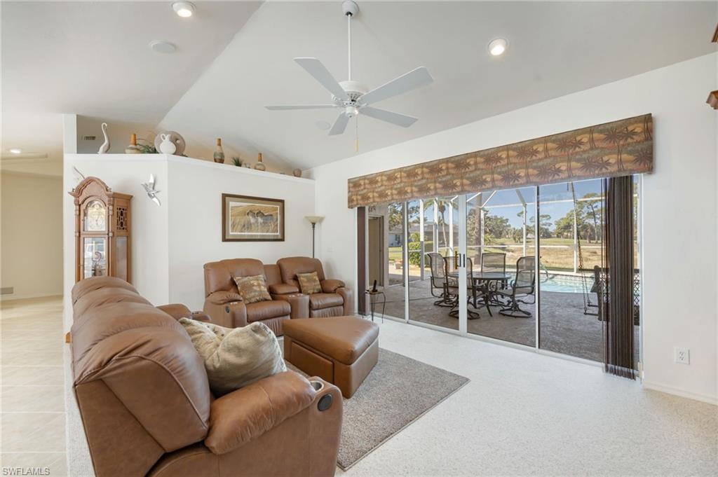 867 St Andrews Boulevard Naples, FL 34113 - Photo 6 of 28 a living room with furniture and a large window