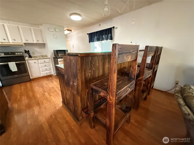 a view of kitchen and wooden floor