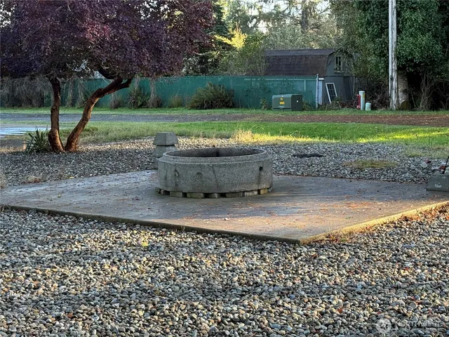 a view of a backyard with trees