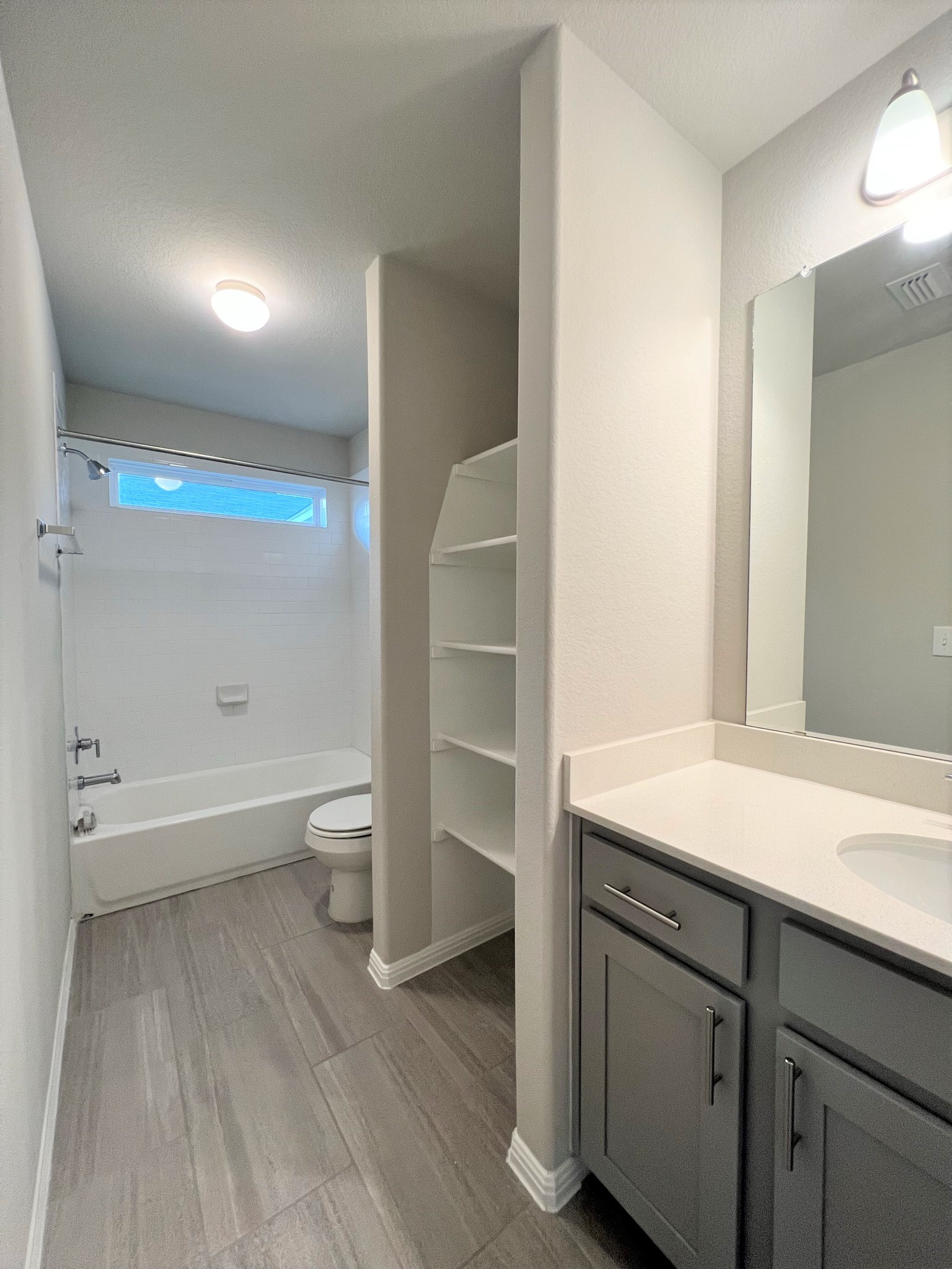 6413 Owl Creek Lane Austin, TX 78747 - Photo 11 of 23 a bathroom with a sink a toilet and a bathtub