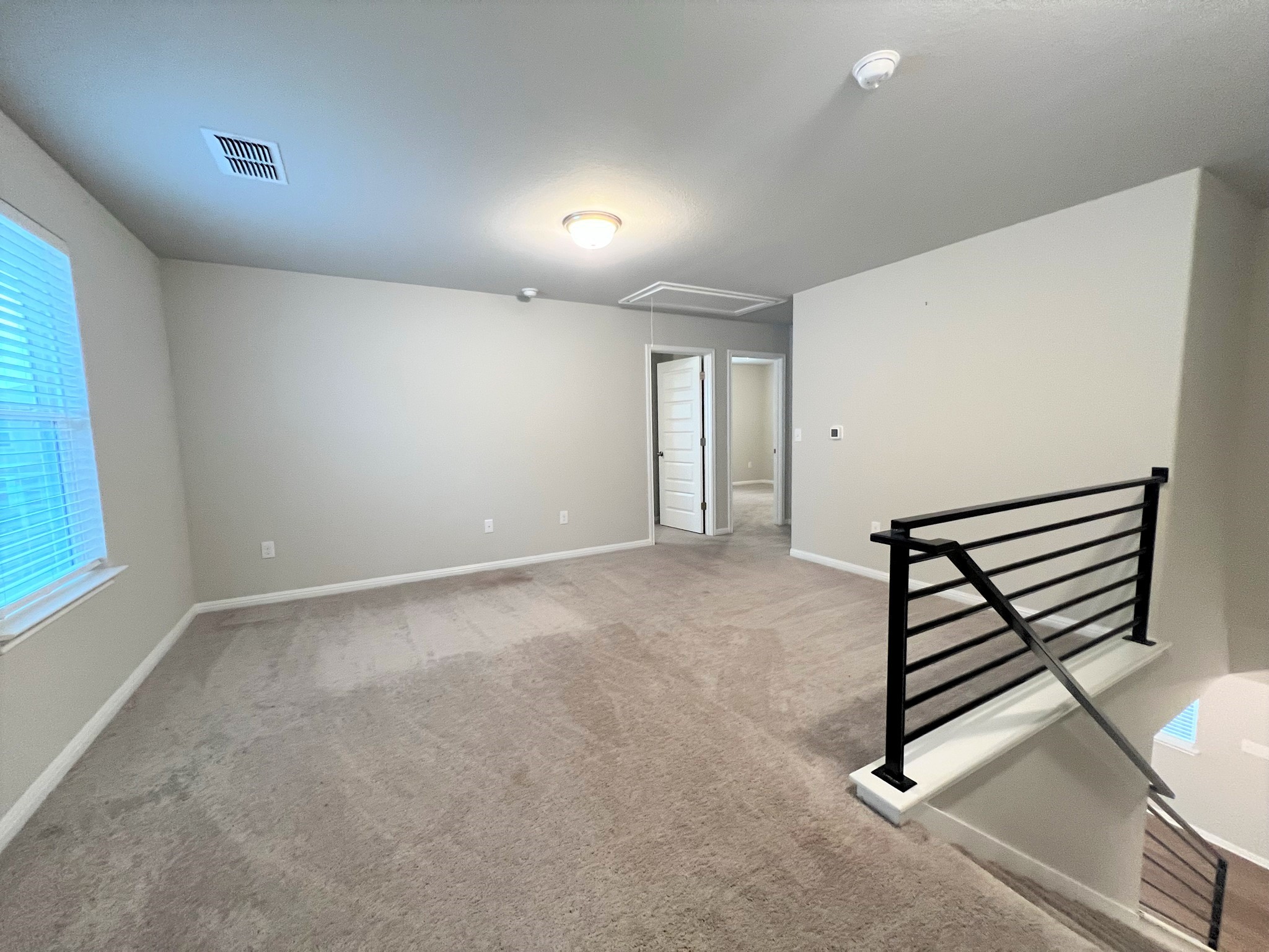 6413 Owl Creek Lane Austin, TX 78747 - Photo 12 of 23 an empty room with windows