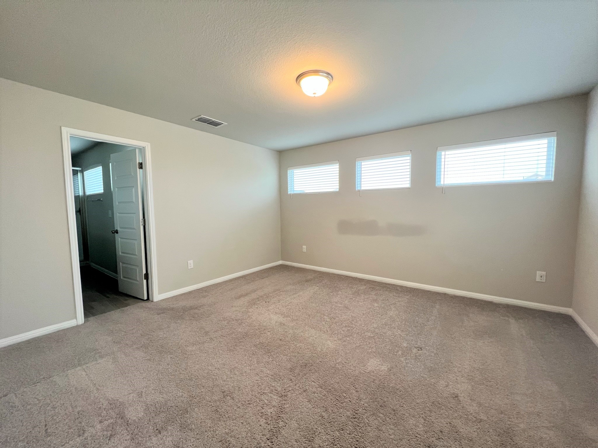 6413 Owl Creek Lane Austin, TX 78747 - Photo 6 of 23 a view of an empty room with a window