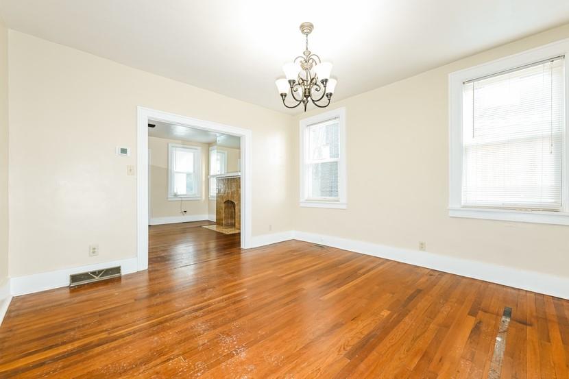 6472 Monitor Street Pittsburgh, PA 15217 - Photo 11 of 39 a view of an empty room with wooden floor and a window