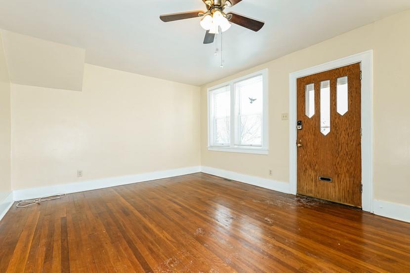 6472 Monitor Street Pittsburgh, PA 15217 - Photo 15 of 39 an empty room with wooden floor chandelier fan and windows