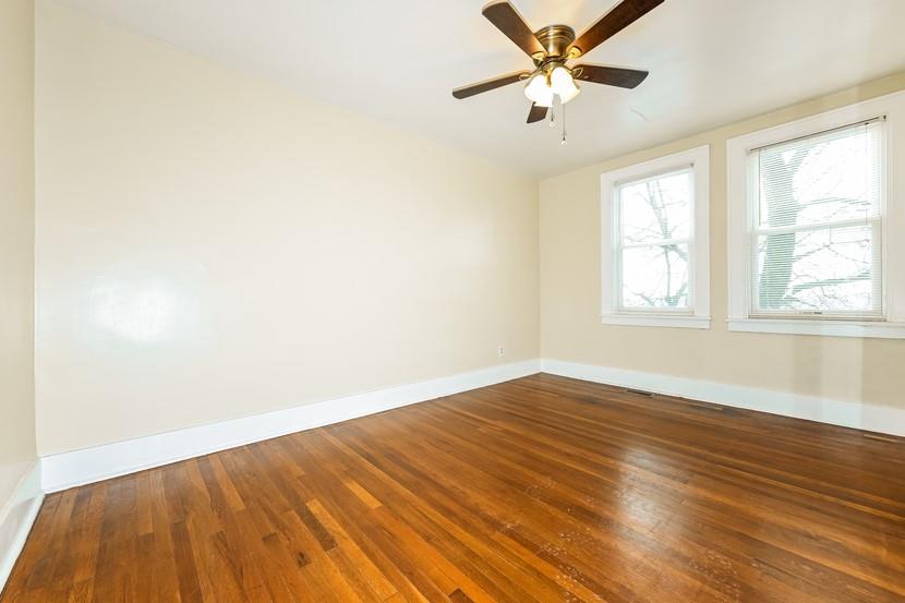 6472 Monitor Street Pittsburgh, PA 15217 - Photo 16 of 39 an empty room with wooden floor fan and windows