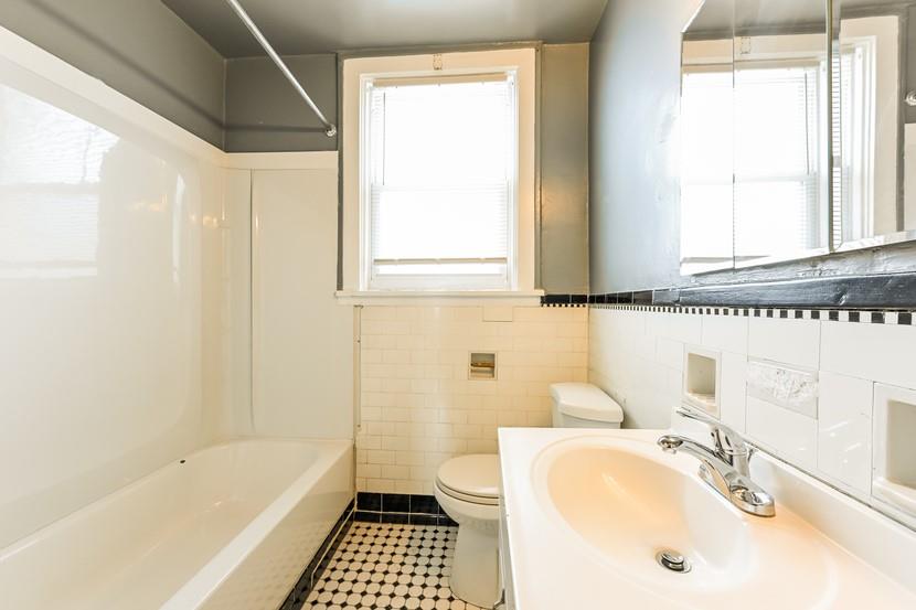 6472 Monitor Street Pittsburgh, PA 15217 - Photo 18 of 39 a bathroom with a sink a toilet and a bathtub