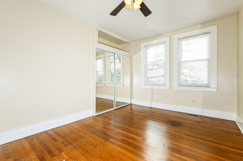 6472 Monitor Street Pittsburgh, PA 15217 - Photo 20 of 39 an empty room with wooden floor fan and windows