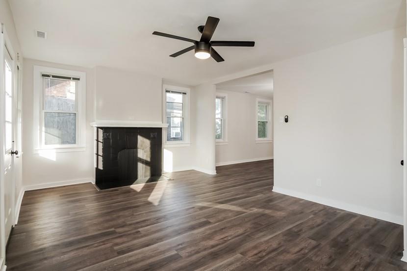 6472 Monitor Street Pittsburgh, PA 15217 - Photo 24 of 39 a view of empty room with wooden floor and fireplace