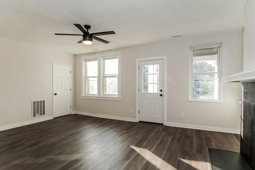 6472 Monitor Street Pittsburgh, PA 15217 - Photo 25 of 39 a view of an empty room with wooden floor and a window