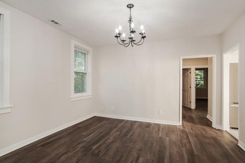 6472 Monitor Street Pittsburgh, PA 15217 - Photo 29 of 39 a view of an empty room with wooden floor and a window