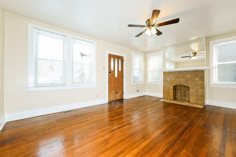 6472 Monitor Street Pittsburgh, PA 15217 - Photo 6 of 39 a view of an empty room with wooden floor and a window