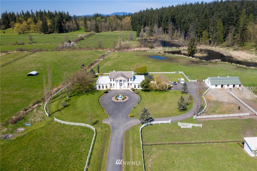 an aerial view of a house having yard